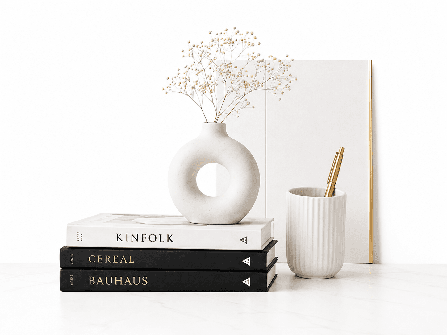 Books, vase and pen holder